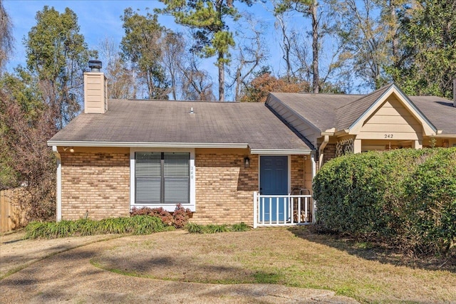 ranch-style house with a front lawn