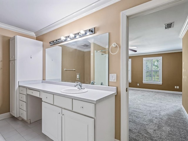 bathroom featuring ceiling fan, vanity, tile patterned floors, and crown molding