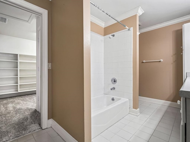 bathroom with vanity, tile patterned flooring, tiled shower / bath combo, and ornamental molding