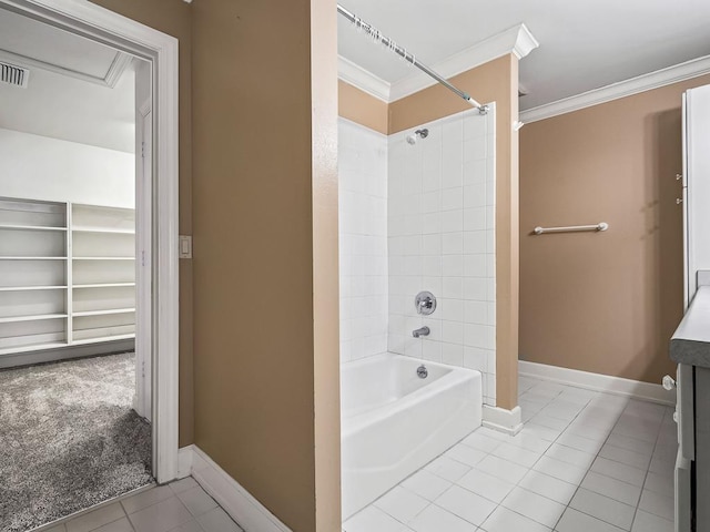 127 Bullen Ln, Perry, FL 32347 - bathroom with ornamental molding, tile patterned flooring, baseboards, washtub / shower combination, and a walk in closet