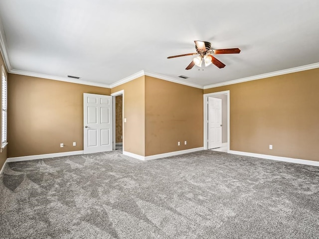 carpeted spare room with ceiling fan and ornamental molding