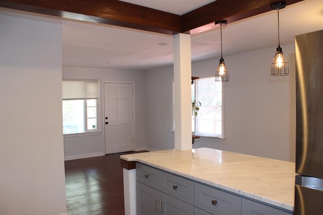 837 Dent St, Tallahassee, FL 32304 - kitchen with hanging light fixtures, light stone countertops, beamed ceiling, gray cabinetry, and dark wood-type flooring
