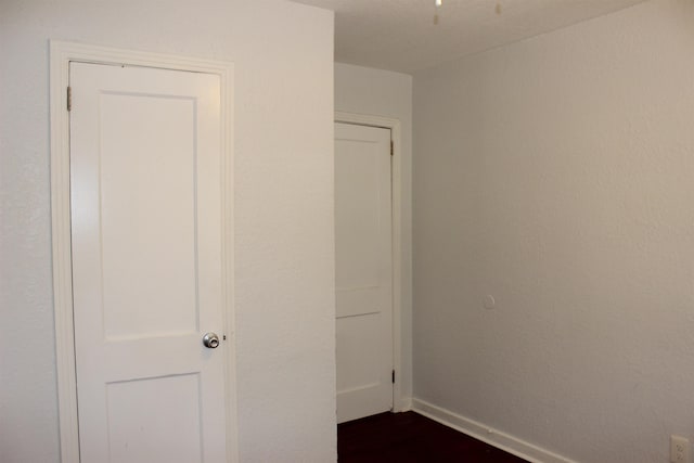 837 Dent St, Tallahassee, FL 32304 - unfurnished room with baseboards and dark wood-style flooring