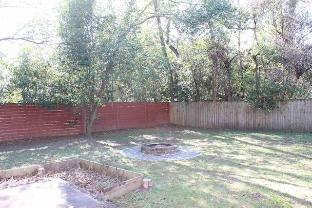 837 Dent St, Tallahassee, FL 32304 - view of yard with a vegetable garden, a fenced backyard, and an outdoor fire pit