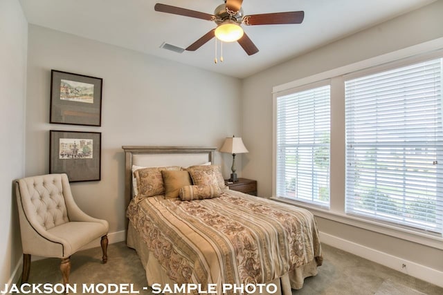 bedroom with light carpet and ceiling fan