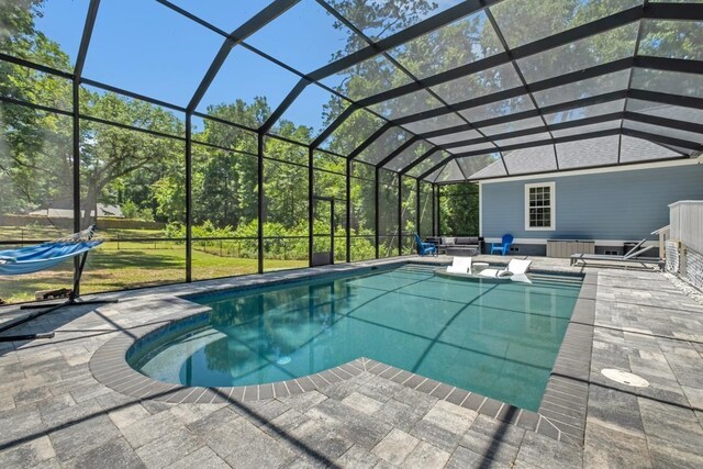 323 Carr Ln, Tallahassee, FL 32312 - swimming pool with a patio area, outdoor lounge area, and glass enclosure
