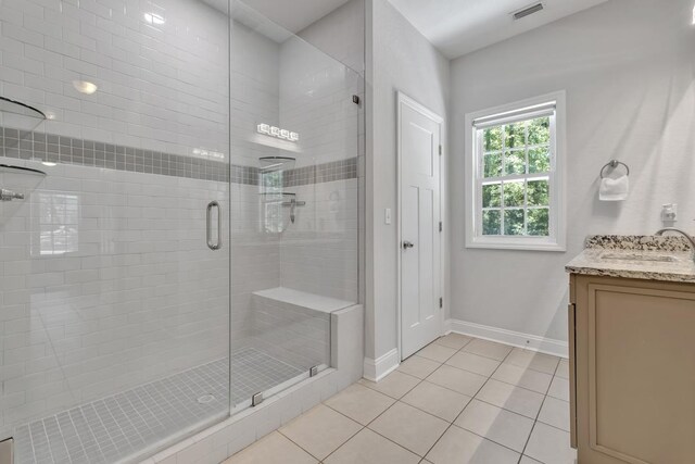 323 Carr Ln, Tallahassee, FL 32312 - full bathroom with tile patterned flooring, a shower stall, baseboards, and vanity
