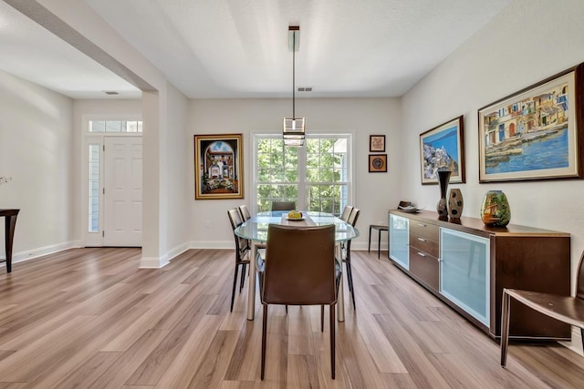 323 Carr Ln, Tallahassee, FL 32312 - dining room featuring light wood-type flooring, healthy amount of natural light, and baseboards