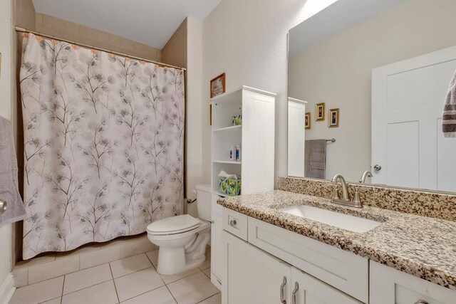 323 Carr Ln, Tallahassee, FL 32312 - bathroom featuring tile patterned flooring, toilet, a shower with shower curtain, and vanity