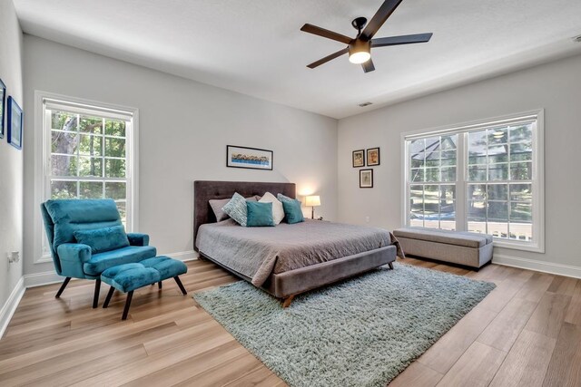 323 Carr Ln, Tallahassee, FL 32312 - bedroom with light wood-style flooring, baseboards, and a ceiling fan