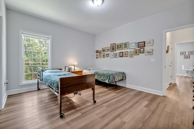 323 Carr Ln, Tallahassee, FL 32312 - bedroom featuring light wood finished floors and baseboards