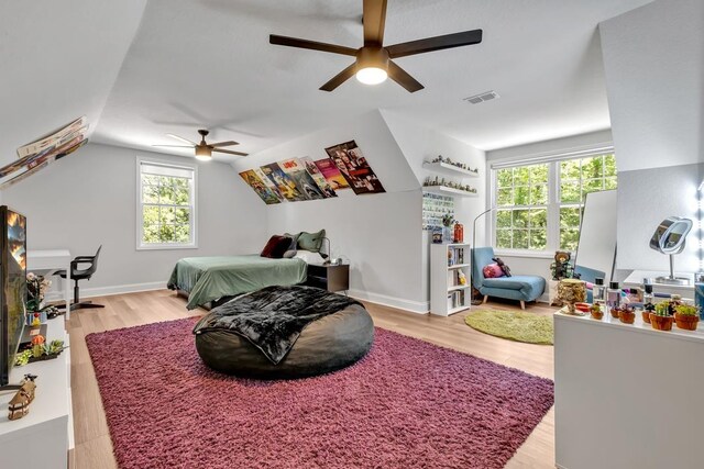 323 Carr Ln, Tallahassee, FL 32312 - bedroom featuring wood finished floors, lofted ceiling, and a ceiling fan