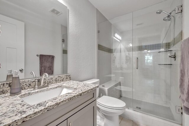 323 Carr Ln, Tallahassee, FL 32312 - full bath featuring toilet, a stall shower, vanity, and a textured wall