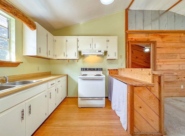 kitchen featuring ceiling fan, electric range, white cabinets, light hardwood / wood-style floors, and lofted ceiling