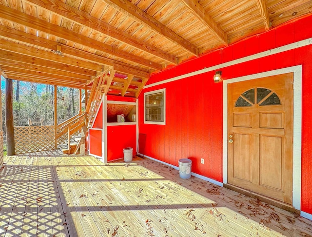 interior space with lofted ceiling with beams and wood ceiling