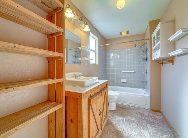 full bathroom with tiled shower / bath combo, toilet, and vanity