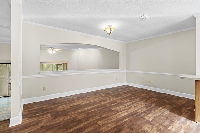 unfurnished room with ornamental molding, a textured ceiling, ceiling fan, and dark wood-type flooring