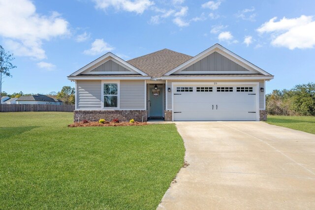 craftsman-style home featuring a front lawn, driveway, brick siding, a garage, and board and batten siding