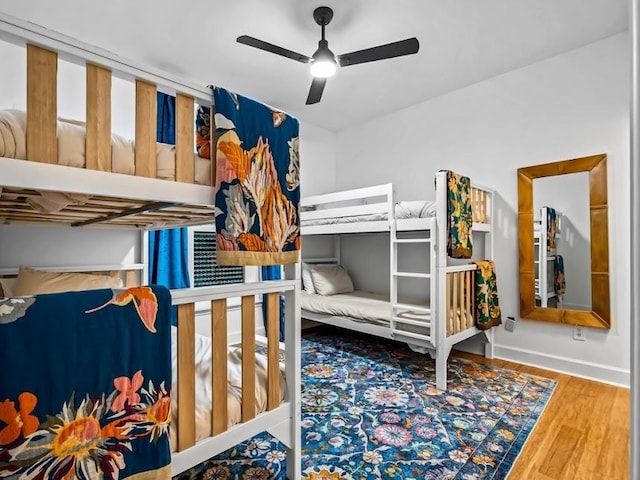 bedroom featuring ceiling fan and wood-type flooring