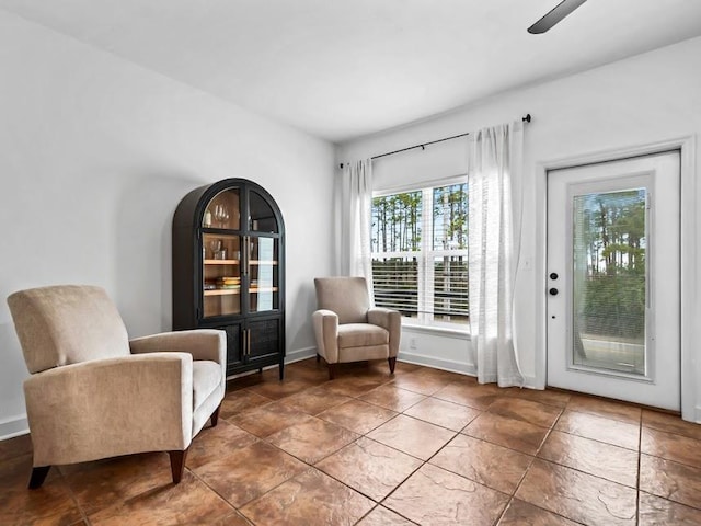 living area with ceiling fan