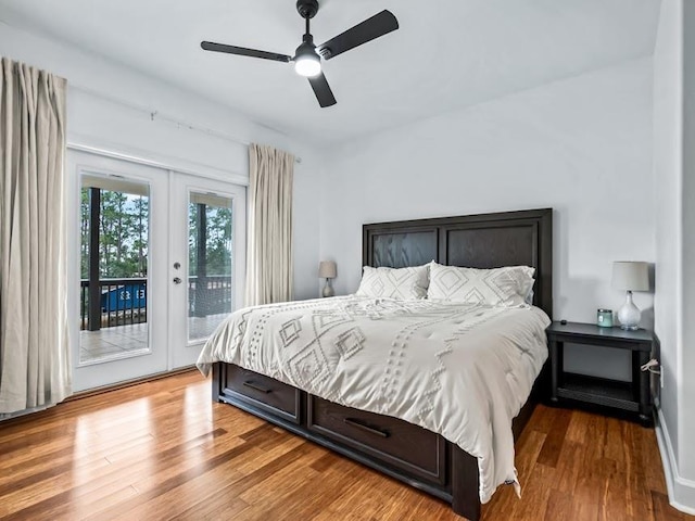 bedroom featuring access to exterior, french doors, hardwood / wood-style flooring, and ceiling fan