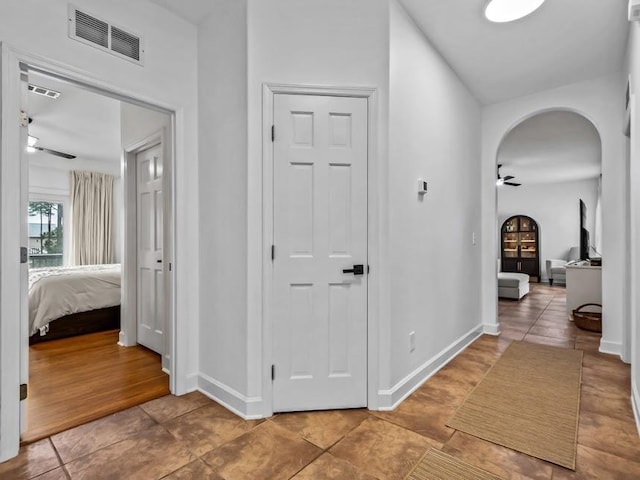 hall with wood-type flooring