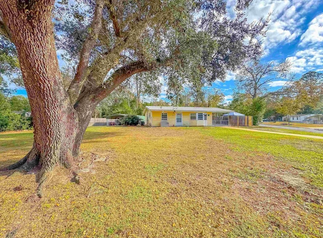 ranch-style home with a front lawn