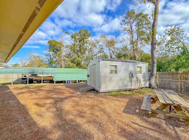 view of outdoor structure with a carport