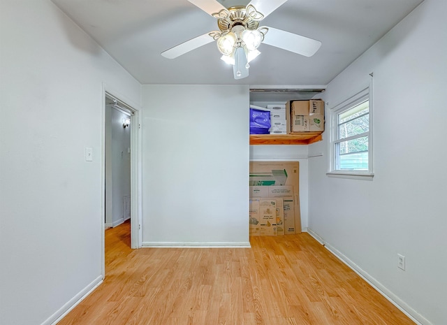 unfurnished room featuring ceiling fan and light wood-type flooring