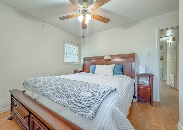 bedroom with light wood-type flooring and ceiling fan