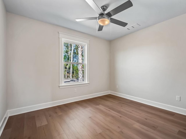 empty room featuring wood-type flooring and ceiling fan