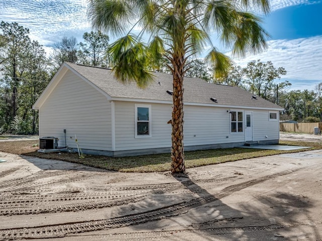 view of home's exterior with cooling unit and a patio area