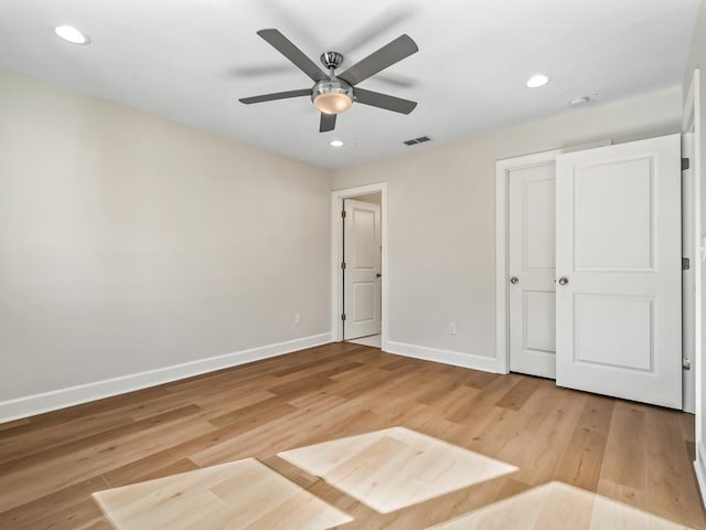 unfurnished bedroom featuring ceiling fan and light hardwood / wood-style flooring