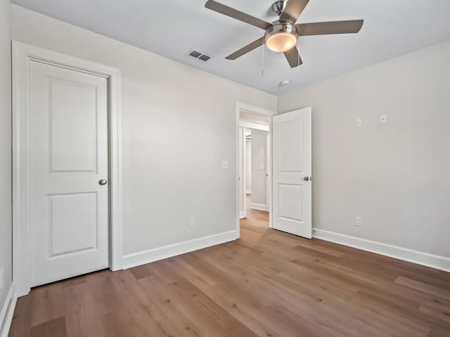 unfurnished bedroom featuring ceiling fan and wood-type flooring