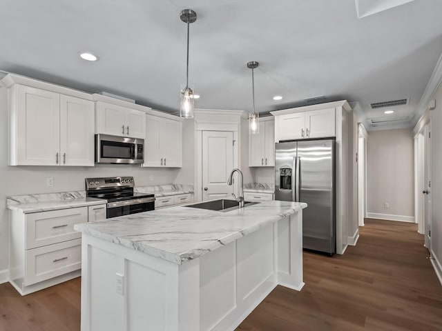 kitchen featuring pendant lighting, sink, a kitchen island with sink, stainless steel appliances, and white cabinets