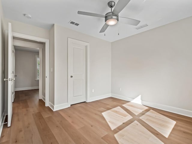 unfurnished bedroom featuring ceiling fan and light wood-type flooring