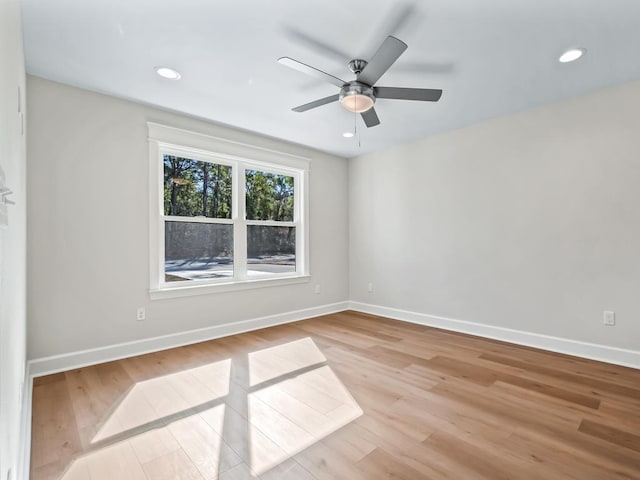 unfurnished room with light hardwood / wood-style flooring and ceiling fan