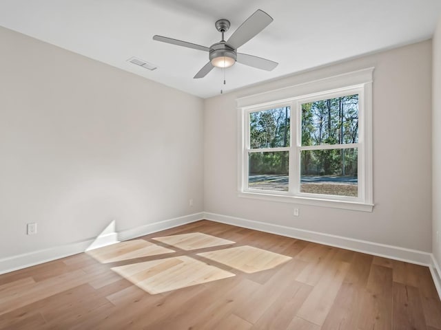 unfurnished room with light hardwood / wood-style flooring and ceiling fan