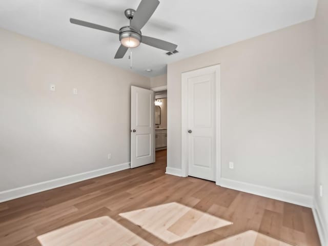 unfurnished bedroom featuring light hardwood / wood-style floors and ceiling fan