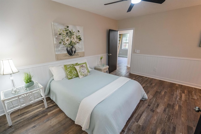 bedroom featuring dark hardwood / wood-style flooring and ceiling fan