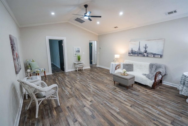 living area featuring dark wood-type flooring, vaulted ceiling, ceiling fan, and ornamental molding