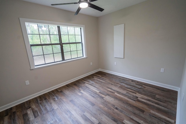 unfurnished room featuring dark hardwood / wood-style flooring and ceiling fan