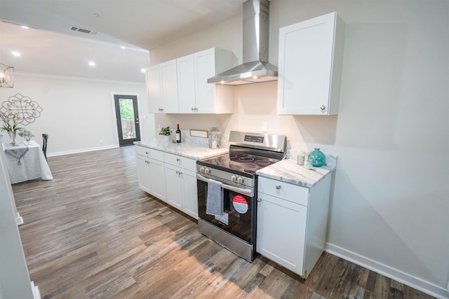 kitchen featuring stainless steel range, dark wood-type flooring, white cabinetry, and wall chimney exhaust hood