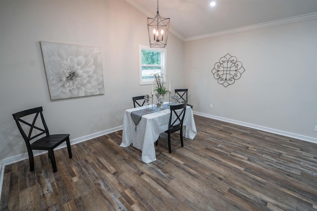 dining space with an inviting chandelier, dark hardwood / wood-style floors, lofted ceiling, and ornamental molding