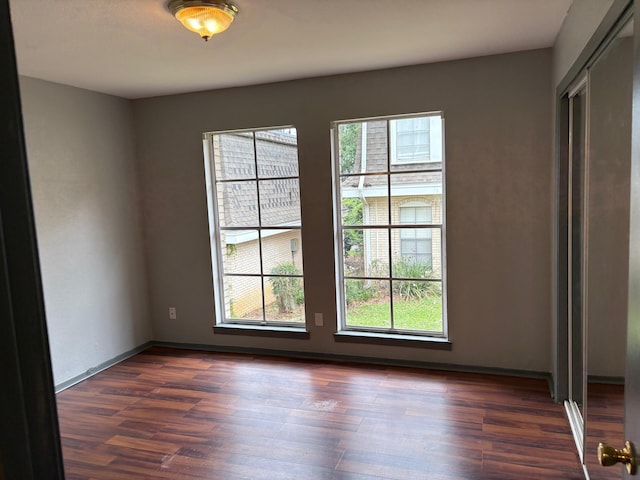 2020 Continental Ave Unit 120, Tallahassee, FL 32304 - spare room with healthy amount of natural light and dark wood finished floors