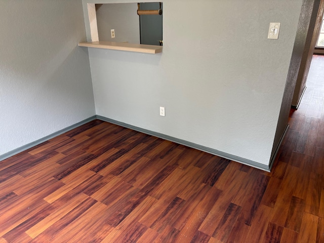 2020 Continental Ave Unit 120, Tallahassee, FL 32304 - empty room with baseboards and dark wood-style floors