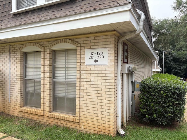 2020 Continental Ave Unit 120, Tallahassee, FL 32304 - view of side of property featuring a shingled roof and brick siding