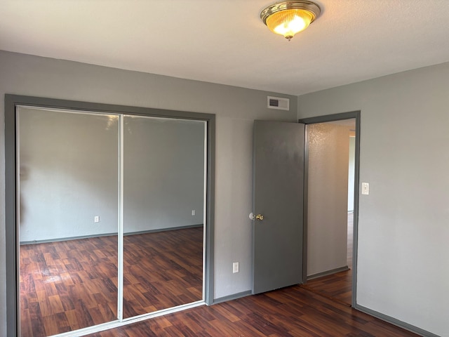 2020 Continental Ave Unit 120, Tallahassee, FL 32304 - unfurnished bedroom with wood finished floors and a closet
