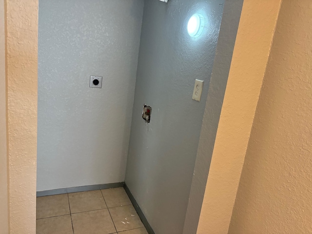 2020 Continental Ave Unit 120, Tallahassee, FL 32304 - laundry room featuring hookup for an electric dryer, a textured wall, and light tile patterned flooring