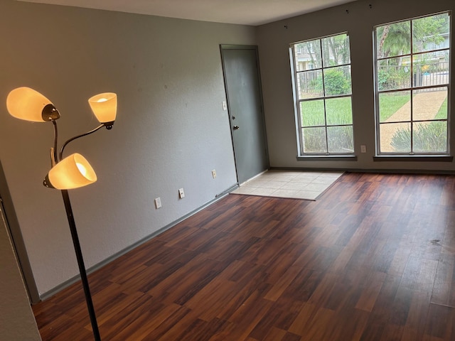 2020 Continental Ave Unit 120, Tallahassee, FL 32304 - empty room with wood finished floors and baseboards